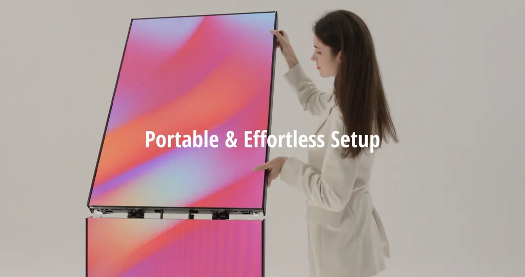 A person unfolding the LED display